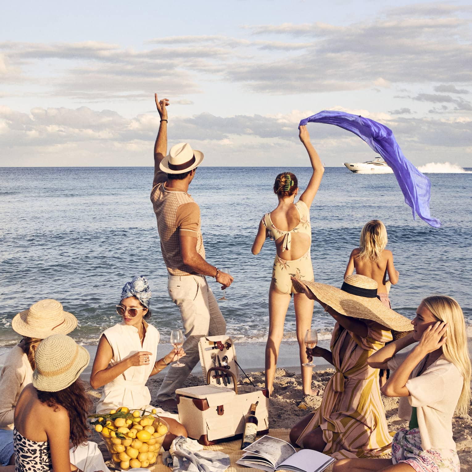 A group of people having a picnic on a beach.