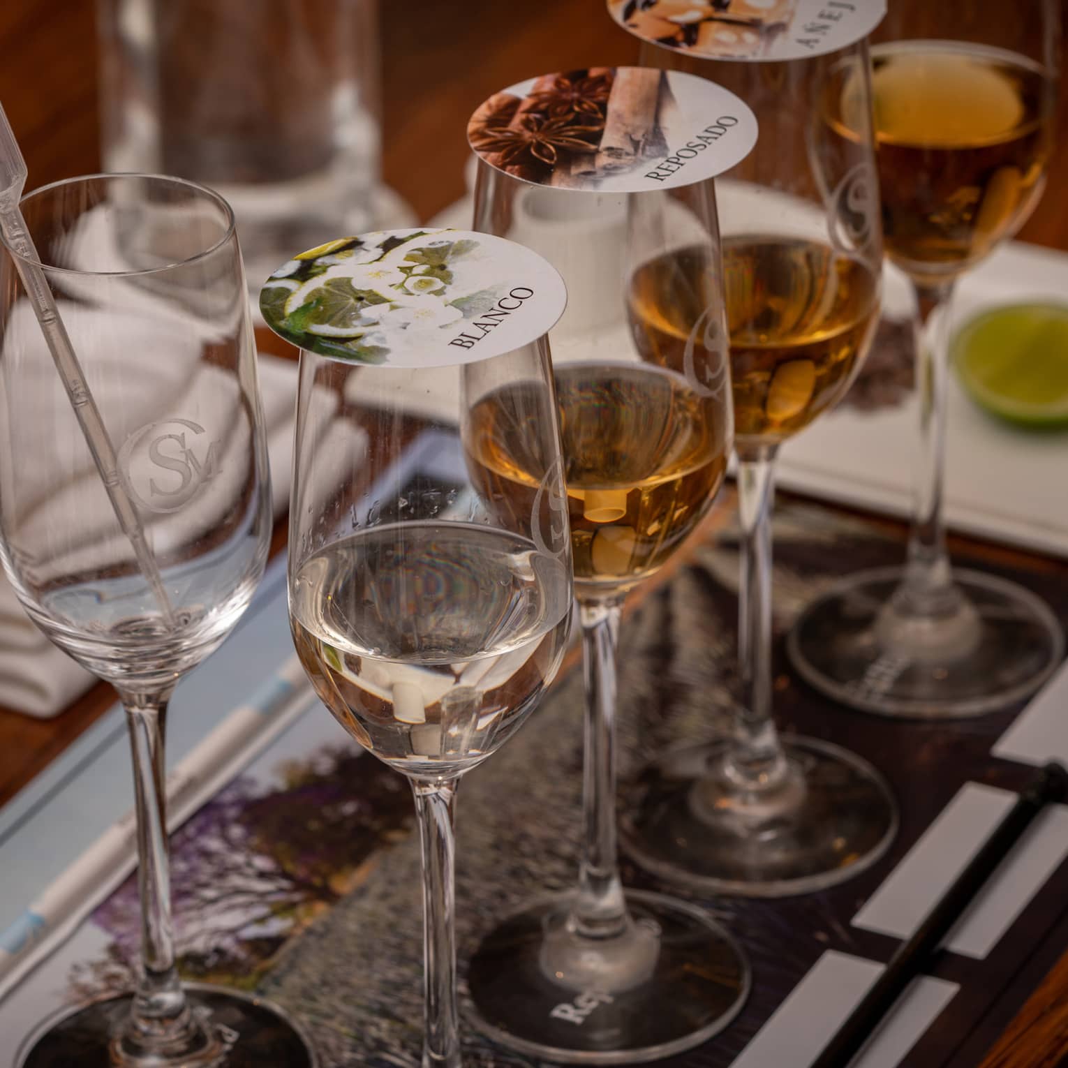 Blending tequila in glasses with covers.