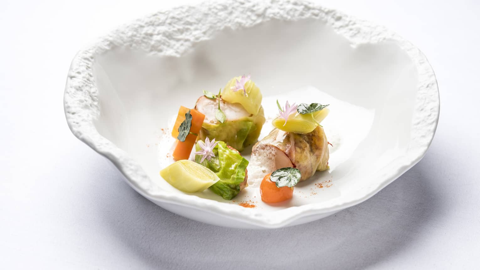 Blue Lobster Nage in artistic white bowl