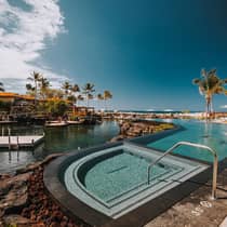 Outdoor swimming pools, palm trees under blue sky