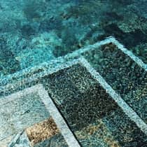 Artistic photo of tiles under blue water