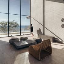 Guest enjoying an ocean view in hotel lounge area