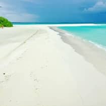 Long white sand private beach, turquoise waters of lagoon