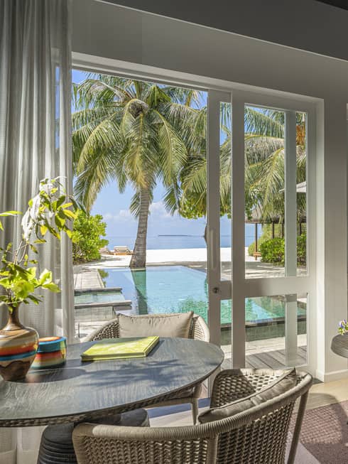 Indoor sitting area and wet bar, leading out to private pool terrace