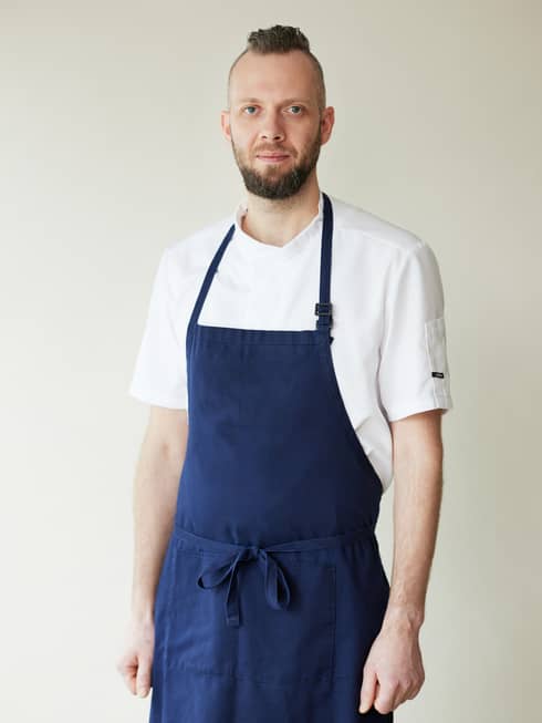 Chef Raul Savi in blue apron