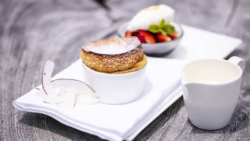 French toast and fresh fruit with coconut garnish