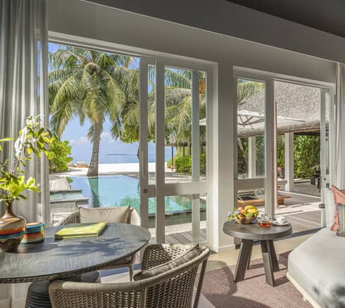 Indoor sitting area and wet bar, leading out to private pool terrace
