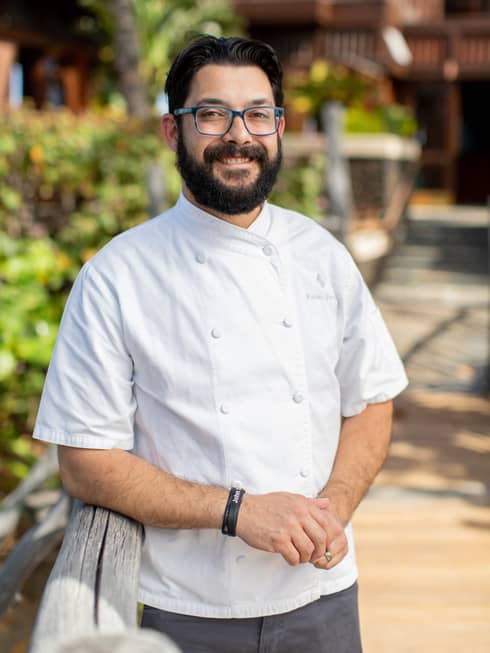 Portrait photo of Chef Kalani Garcia in unform