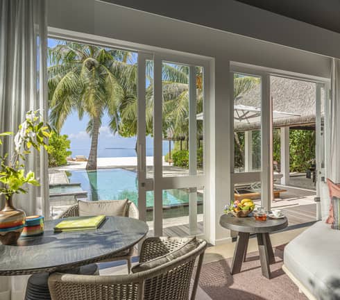 Indoor sitting area and wet bar, leading out to private pool terrace