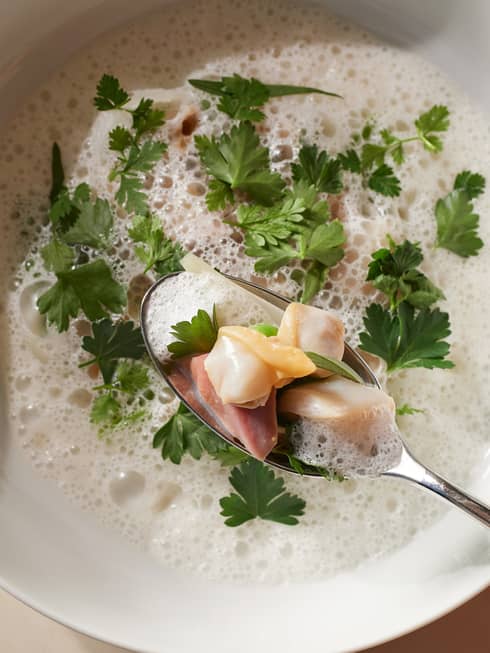 Traditional Japanese fish stew garnished with fresh coriander