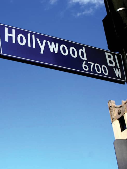 Hollywood Boulevard sign with blue sky background.