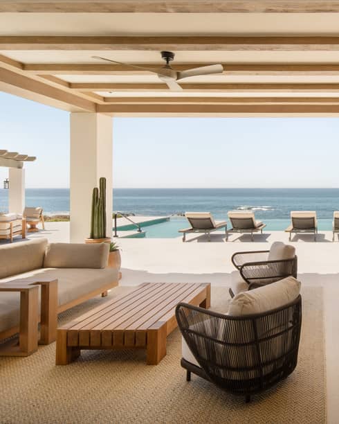 Luxury oceanfront suite terrace with dining, lounge and pool furniture, at Four Seasons Resort Cabo San Lucas at Cabo Del Sol