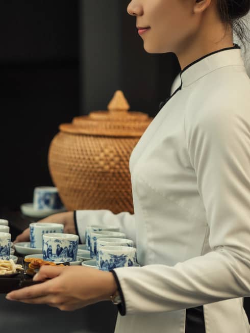 Tea is served from decorative ceramic cups in Vietnam