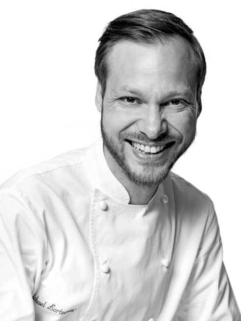 Black and white portrait photo of Chef Michaël Bartocetti in uniform