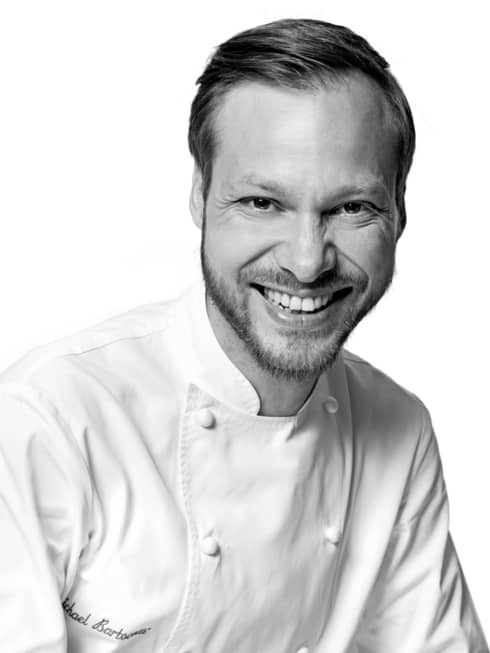Black and white portrait photo of Chef Michaël Bartocetti in uniform