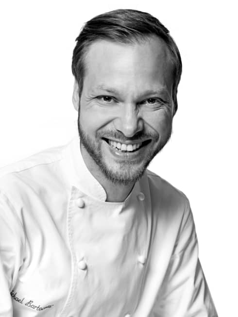 Black and white portrait photo of Chef Michaël Bartocetti in uniform