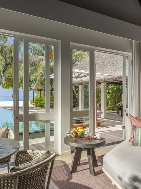 Indoor sitting area and wet bar, leading out to private pool terrace