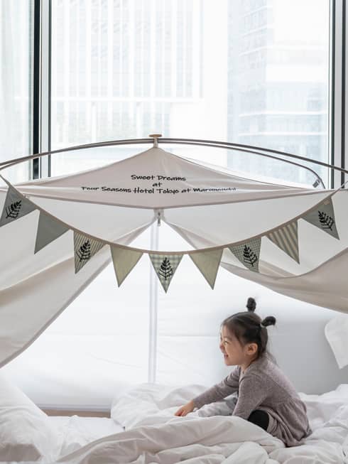 Little girl in kids glamping tent