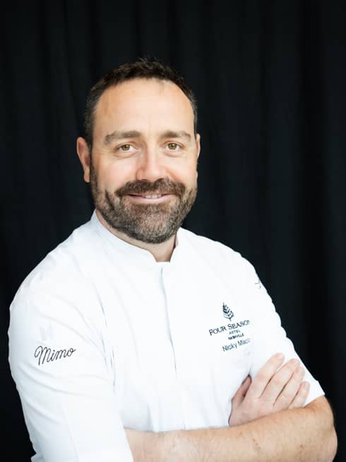 Chef Nicky portrait in a Four Seasons chefs coat