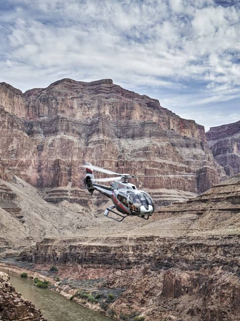 Helicopter flies over Grand Canyon