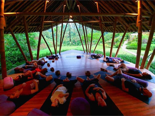 People enjoying open air yoga at luxury resort, photo by ingridbottskiyoga