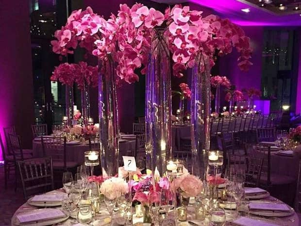 Pink table decorations and setting at luxury hotel event venue