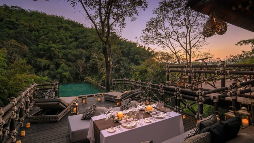 Dining table on patio in front of private pool at Two-bedroom Explorer's Lodge
