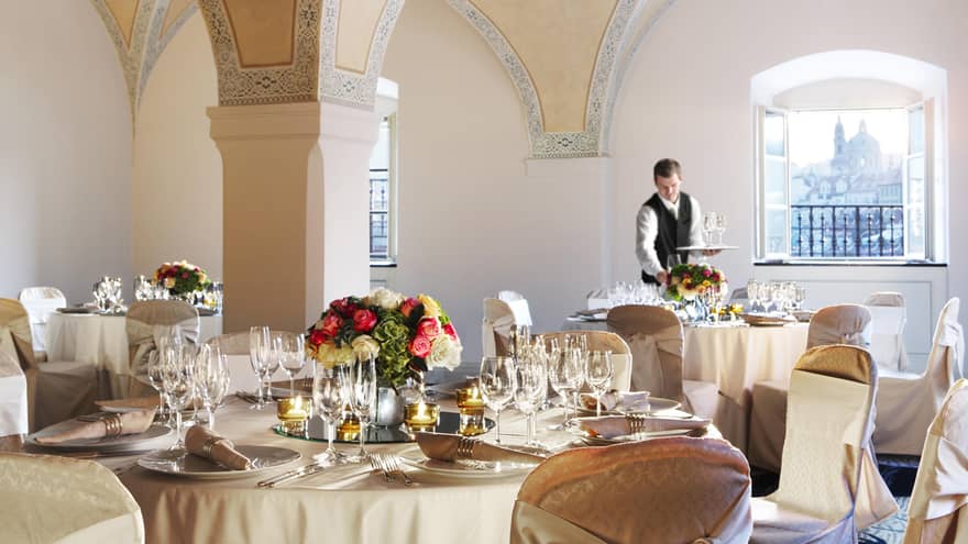 Elegant banquet room, beautifully arranged with tables and chairs for a wedding celebration