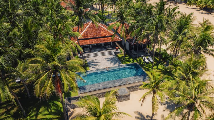 Aerial view of a villa with pool