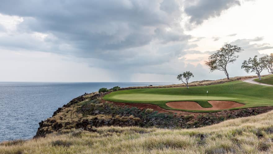 Manele Golf Course green on edge of cliff overlooking ocean