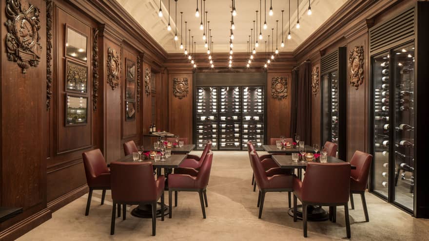 Chateau Latour Discovery private wine tasting room with rows of lights hanging from ceiling