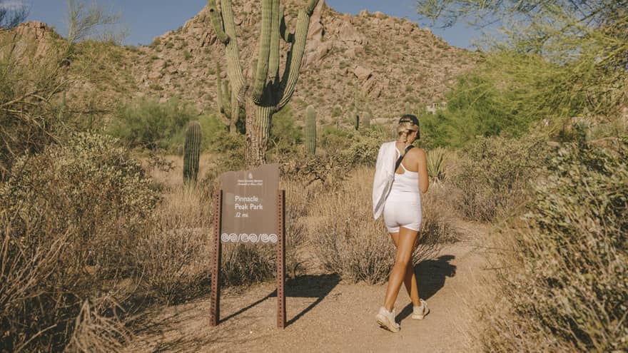 A guest wearing exercise clothes and going on a hike in the desert