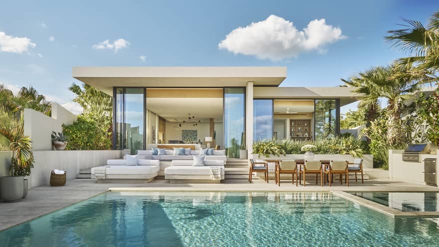 Private villa wth outdoor pool and stylish pool deck with lounge and dining furniture at Four Seasons Resort and Residences Los Cabos