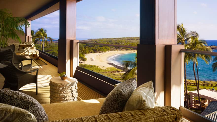 Open-air lanai with sofas, lounge furniture overlooking beach, ocean
