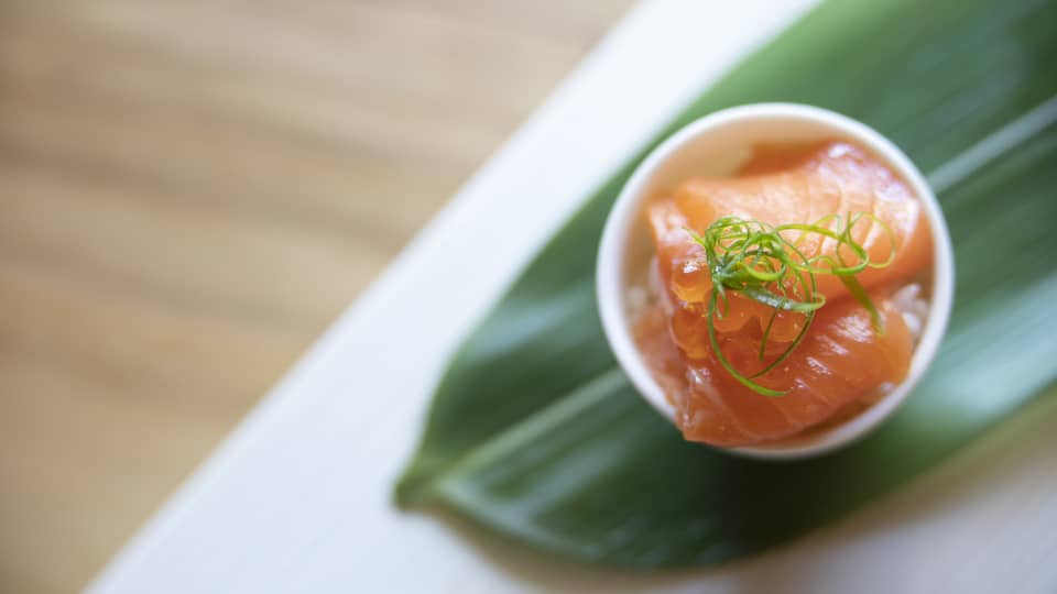 Fresh salmon plated on a banana leaf