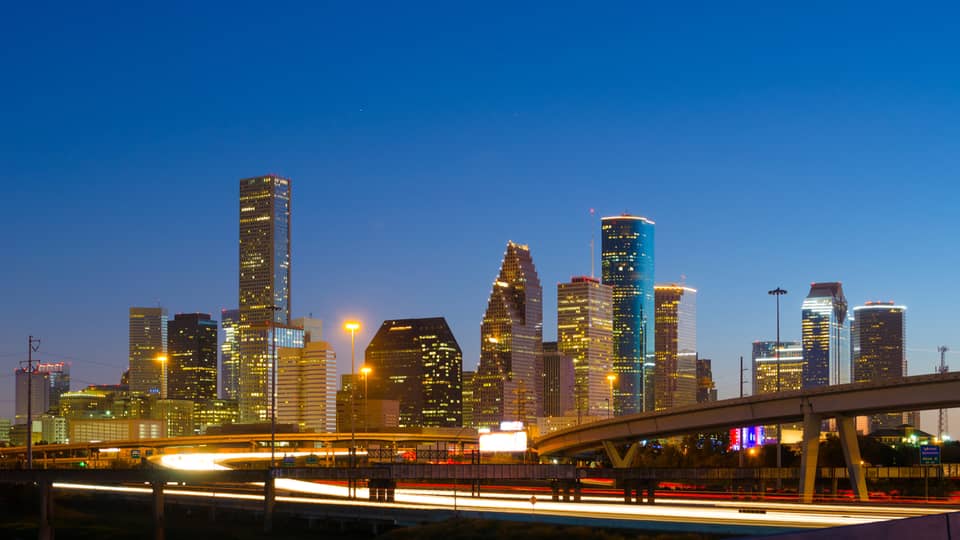 Houston city skyline, highway at night