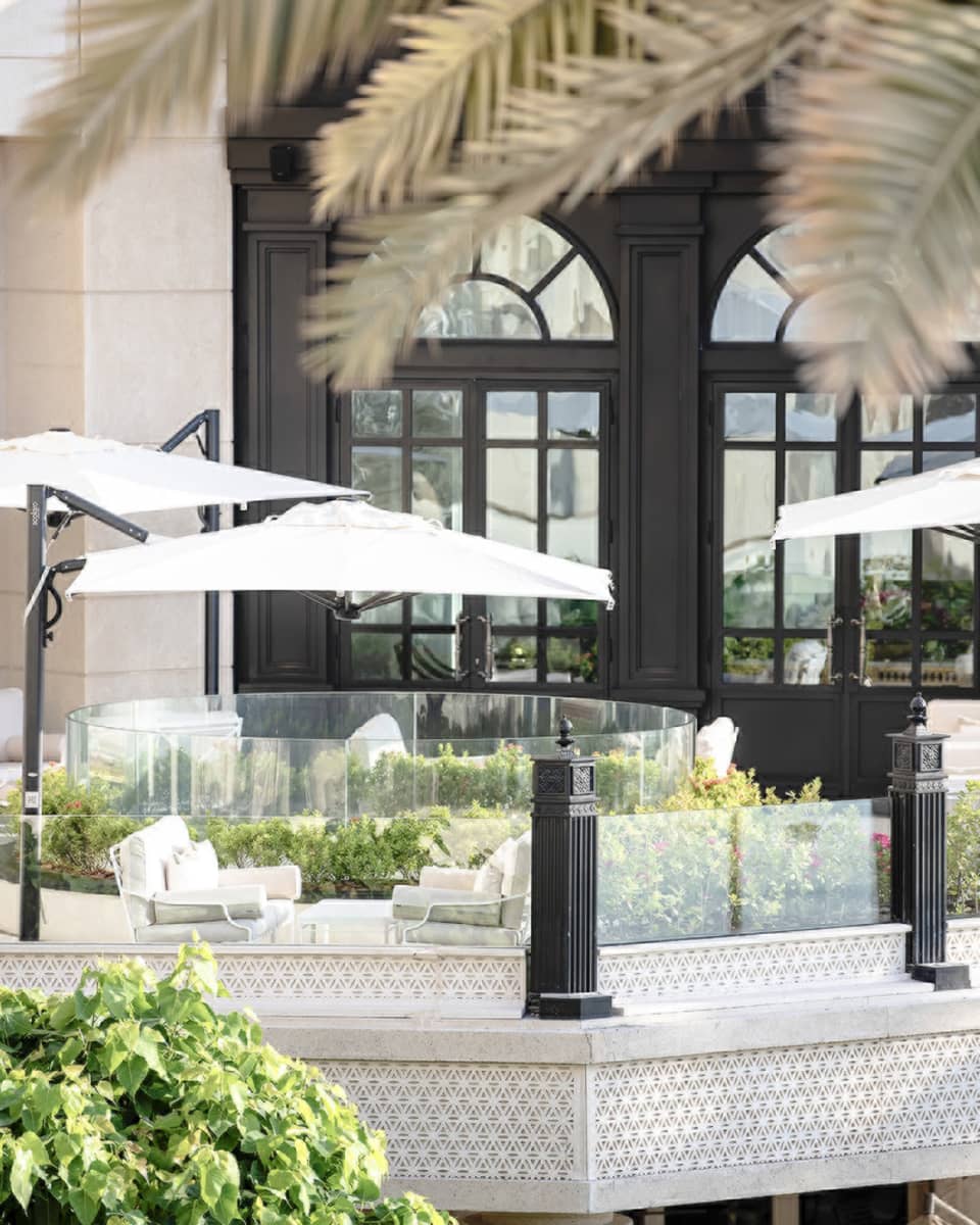 Seasons Tea Lounge patio lounge sofas under white umbrellas