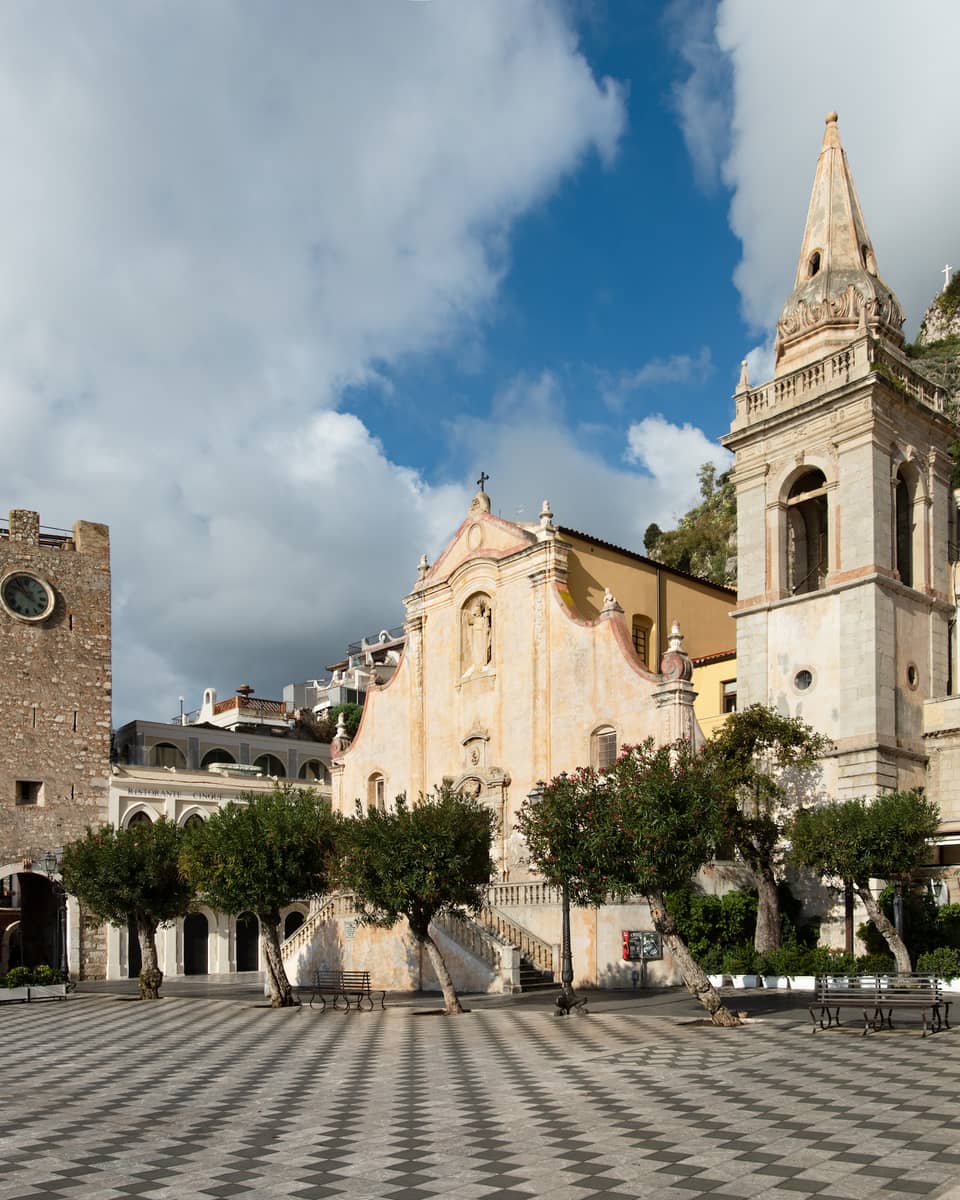 Piazza IX Aprile, photographed from a low angle on the tiled ground, in Taormina, Sicily
